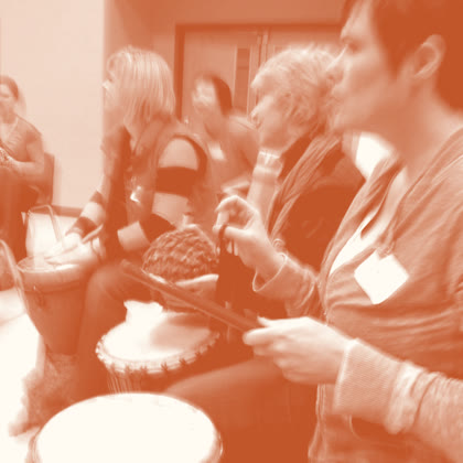 Drummers focused and listening closely as they play together