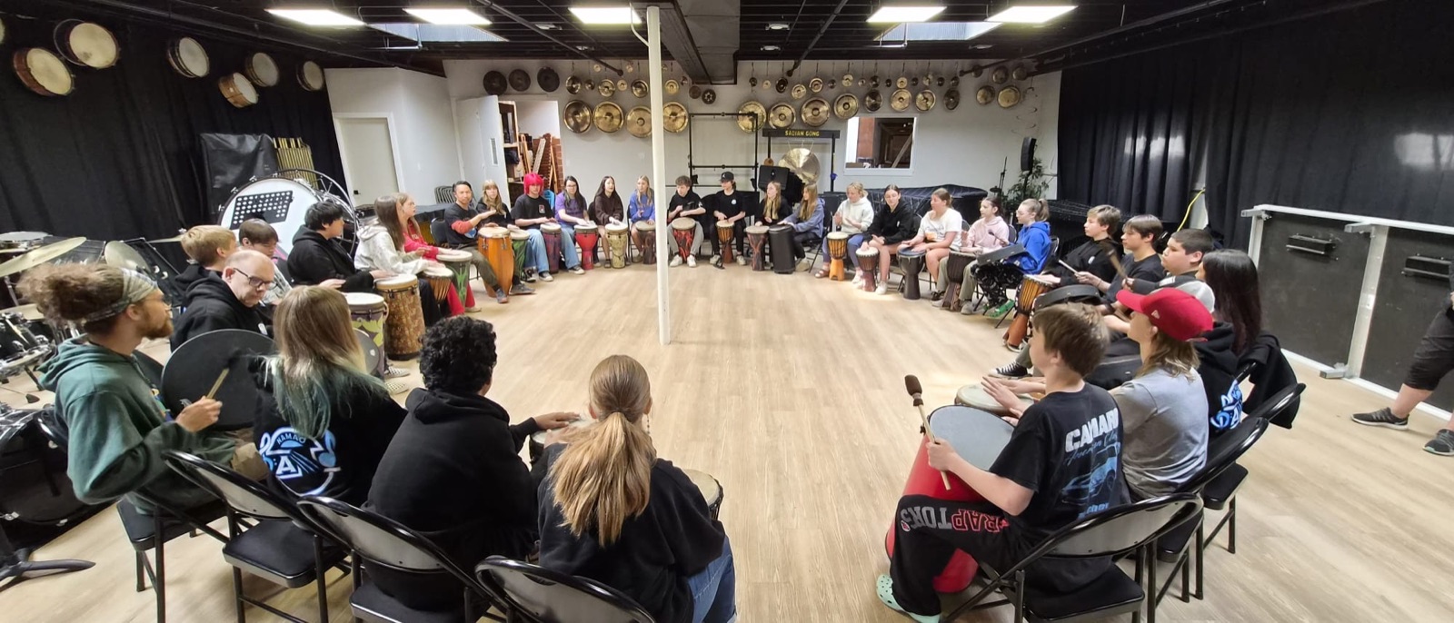 A team drumming together
