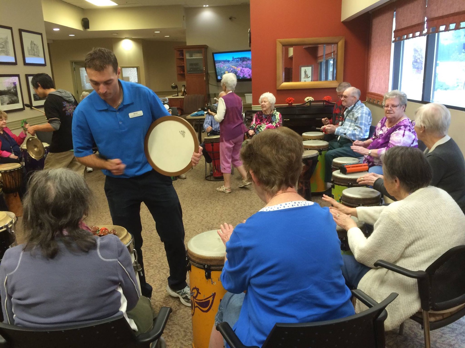 Seniors drumming together in a circle